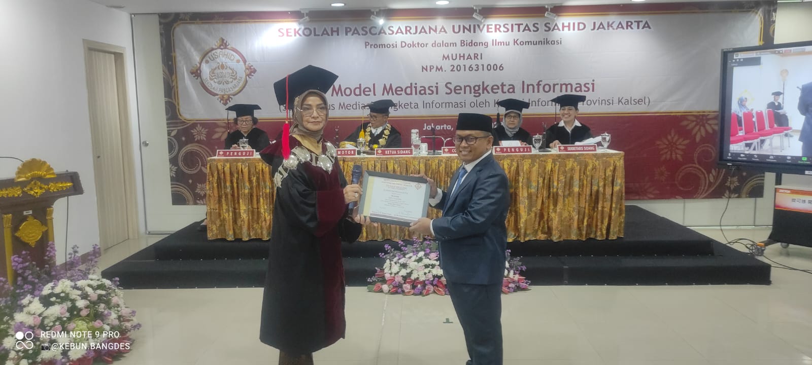 Kepala Bidang Informasi Komunikasi Publik ( IKP ) Dinas Komunikasi, Informatika, Statistik dan Persandian Kabupaten Banjar Muhari menyampaikan Disertasi pada tahap Promosi Program Studi Doktor Ilmu Komunikasi Sekolah Pasca Sarjana Universitas Sahid Jakarta, Jumat ( 21/07/2023 ) sore. (Kalimantanlive.com)